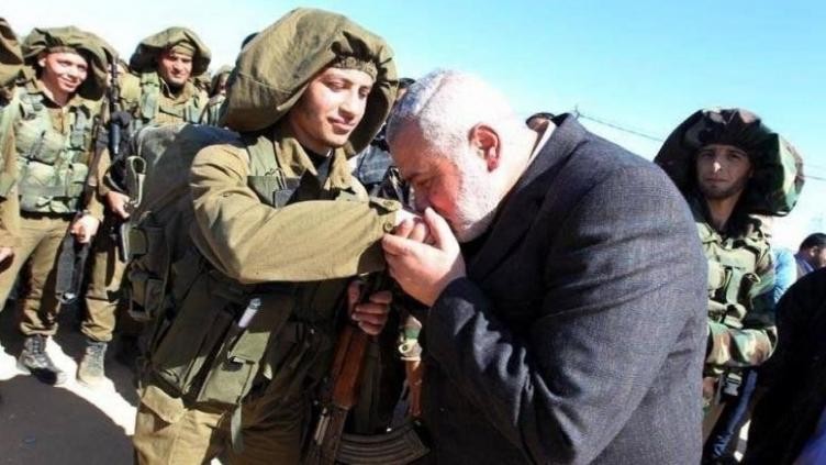 هذه الصورة لهنية مع مقاتل فلسطيني وليس جندي إسرائيلي